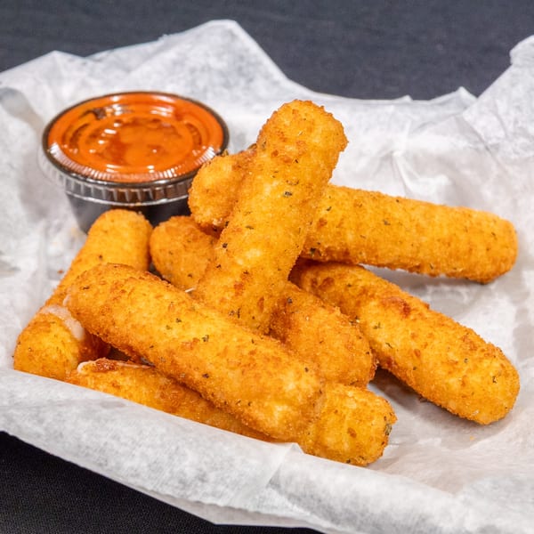 Golden-brown mozzarella sticks with herbs, served in a paper-lined basket with a side of marinara sauce.